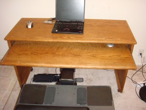 Humanscale keyboard tray attached to my oak desk